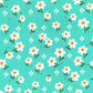 small white daisy on teal fabric