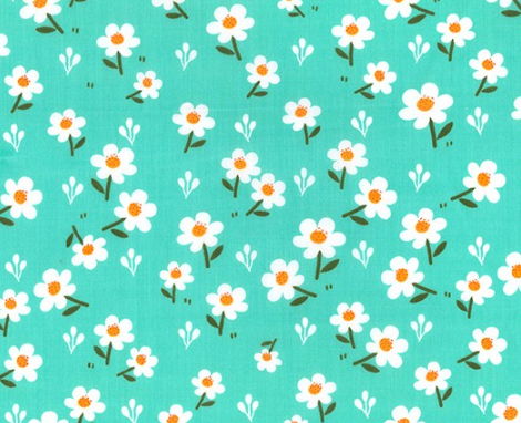 small white daisy on teal fabric